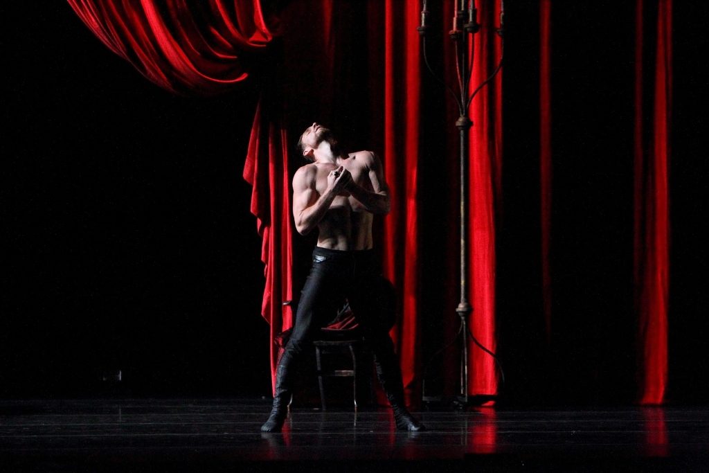 In this example of toning, also from the Dayton Ballet’s Dracula: Bloodlines, saturated red lighting is focused to pull out the red drapery. Red lighting is focused solely on the curtain to allow it to look as the scenic designer intended while still keeping the main scene dim and shadowy.
Lighting Design by the Joe Beumer. Photo by Geek with a Lens Photography.